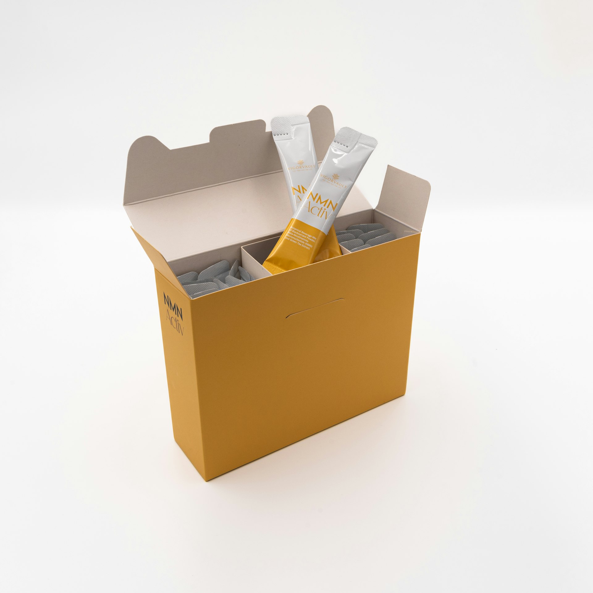 A yellow box with a pair of scissors in it